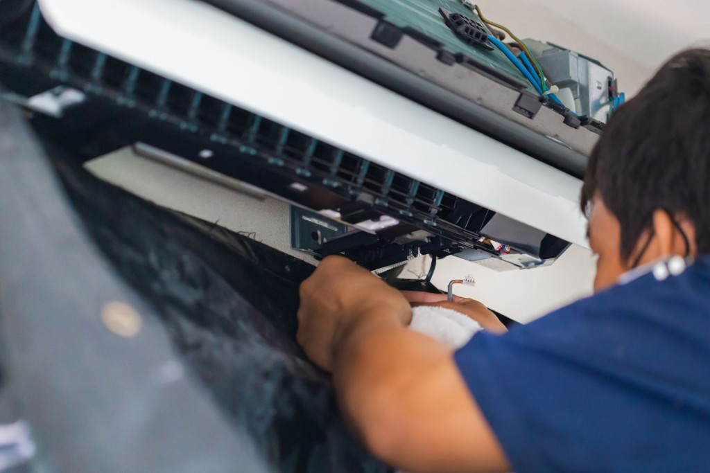  A technician repairing an air conditioner

