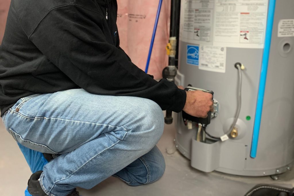 A man repairing a boiler