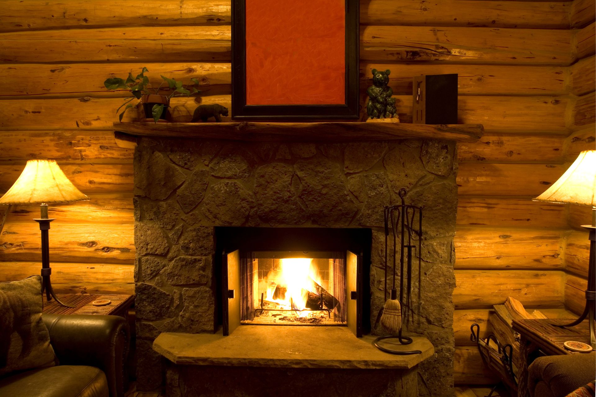 A lit fireplace inside a living room 