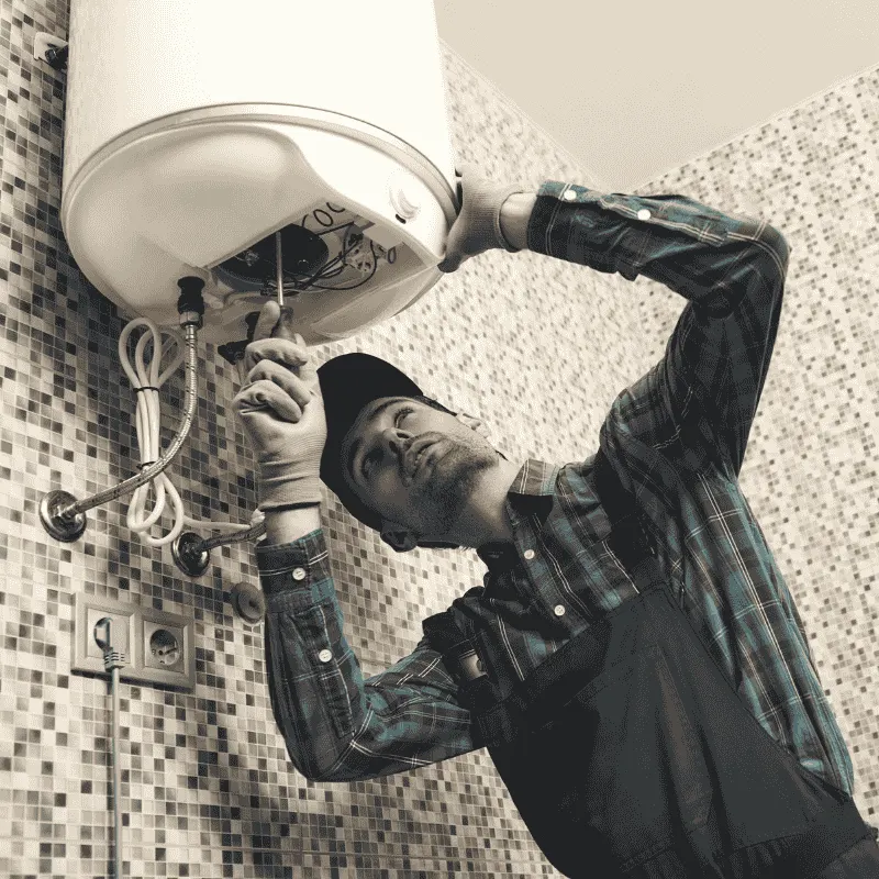 LG Home Comfort technician repairing a water heater in Scarborough