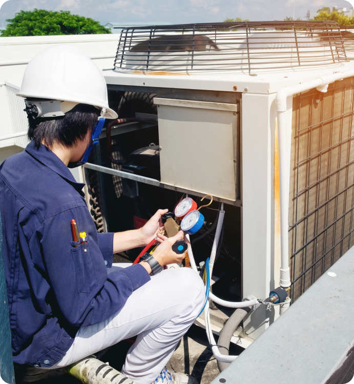 Technician ensuring clean air flow with new furnace filter in Kitchener - LG Home Comfort