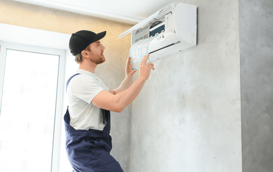 Technician-installing-new-AC-system-in-Fergus-ON-home-LG-Home-Comfort