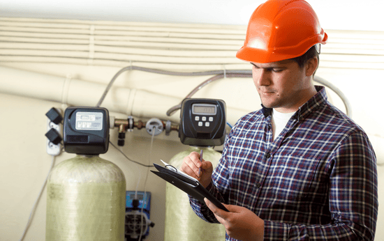 Certified technician installing advanced water purification system in Mount Forest, ON - LG Home Comfort