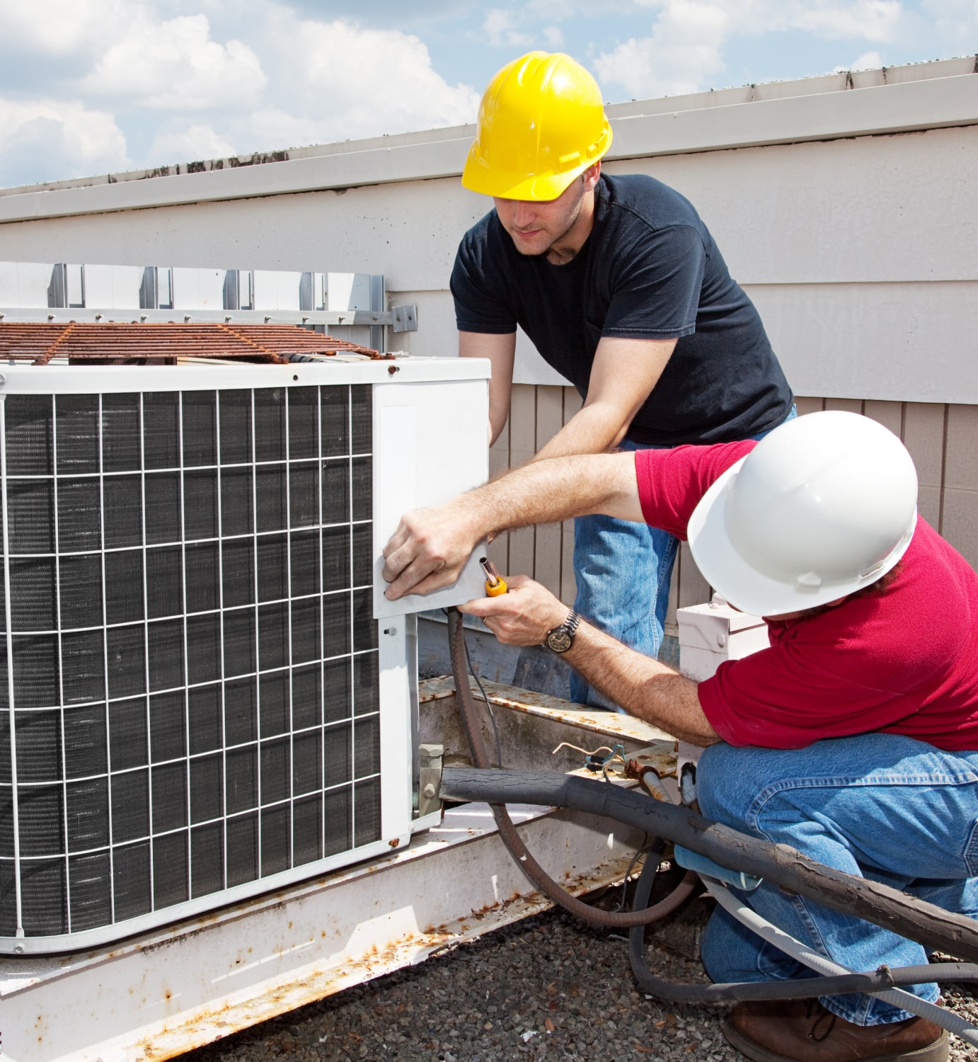 Professional technician performing AC part replacements in Mount Forest, ON - LG Home Comfort