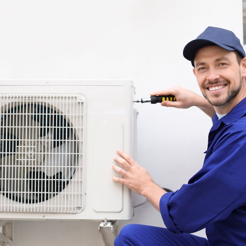 Certified technician installing an energy-efficient heat pump in Cambridge, ON – LG Home Comfort