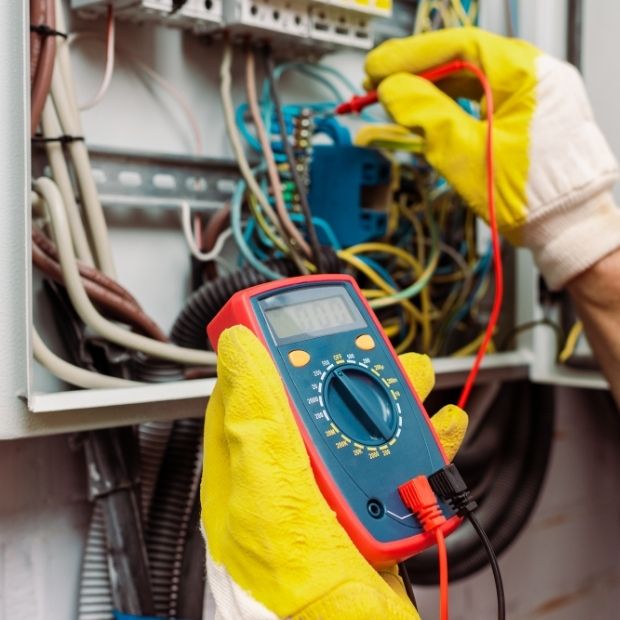 Certified electrician conducting safety inspection on home electrical system by LG Home Comfort