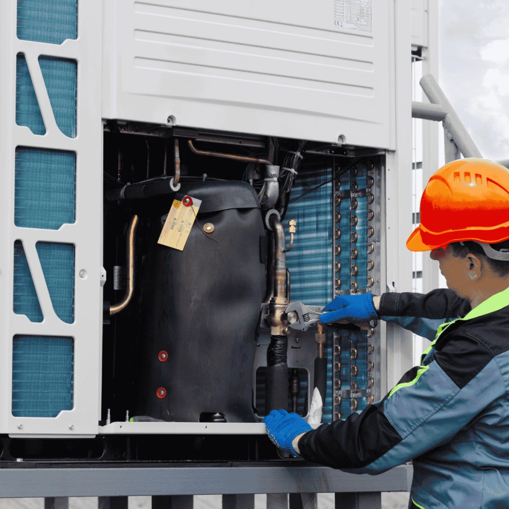Technician replacing a bad capacitor in the AC