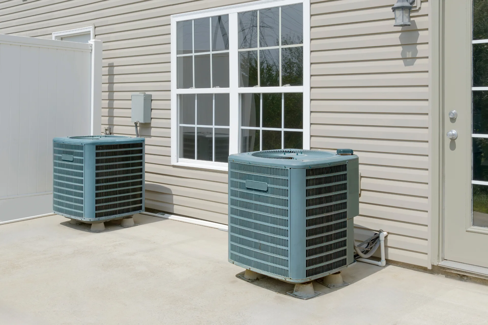 Two air conditioning units under the sun