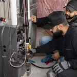 HVAC technicians doing maintenance and repairs 