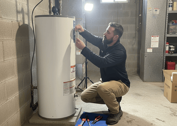 LG Home Comfort technician discussing water heater options with a homeowner during installation consultation in Scarborough